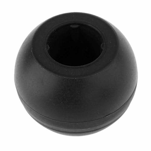 Black round plastic object with central opening