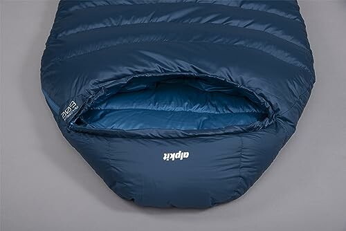 Top view of a blue sleeping bag with a visible opening.