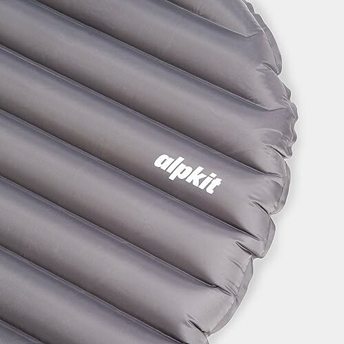 Gray inflatable sleeping pad with brand logo.