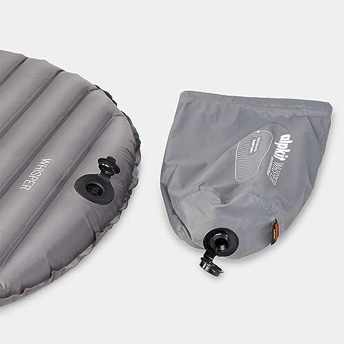 Inflatable sleeping pad with pump bag attachment.