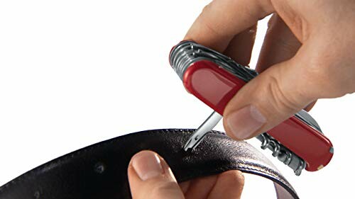 Person using a multi-tool to punch a hole in a leather belt.