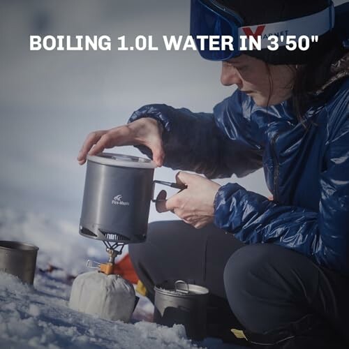 Person outdoors using camping stove to boil water in snow.