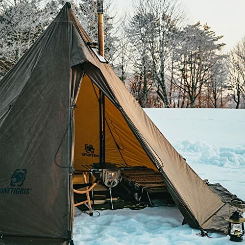 Tent set up in snowy landscape with visible stove inside